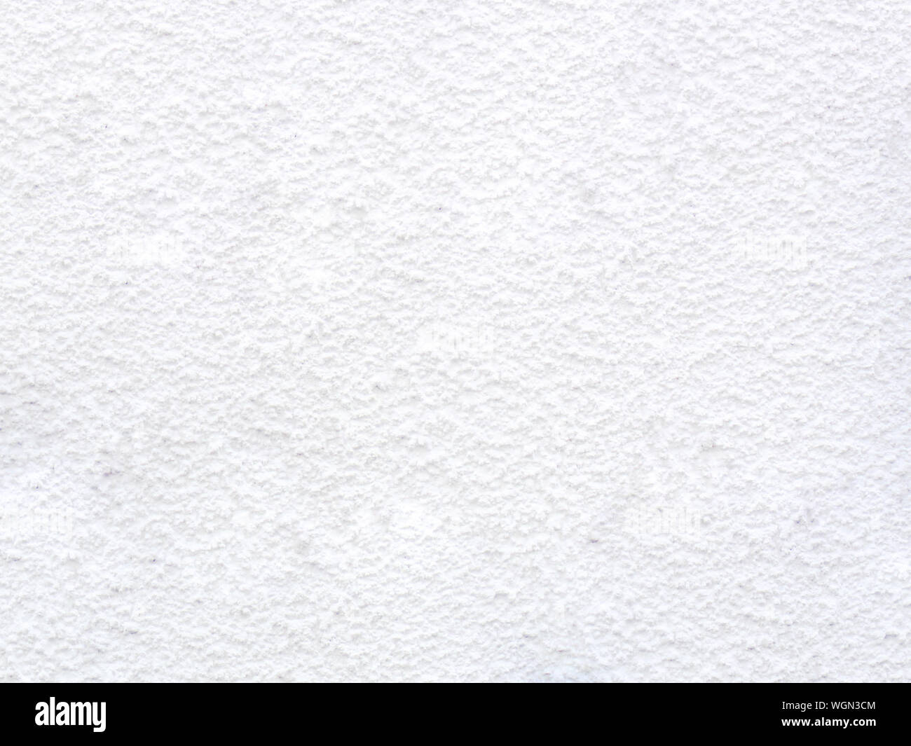 Texture of concrete wall with decorative plaster - photo. White colour. Granularity, roughness. Facade. Background. Stock Photo