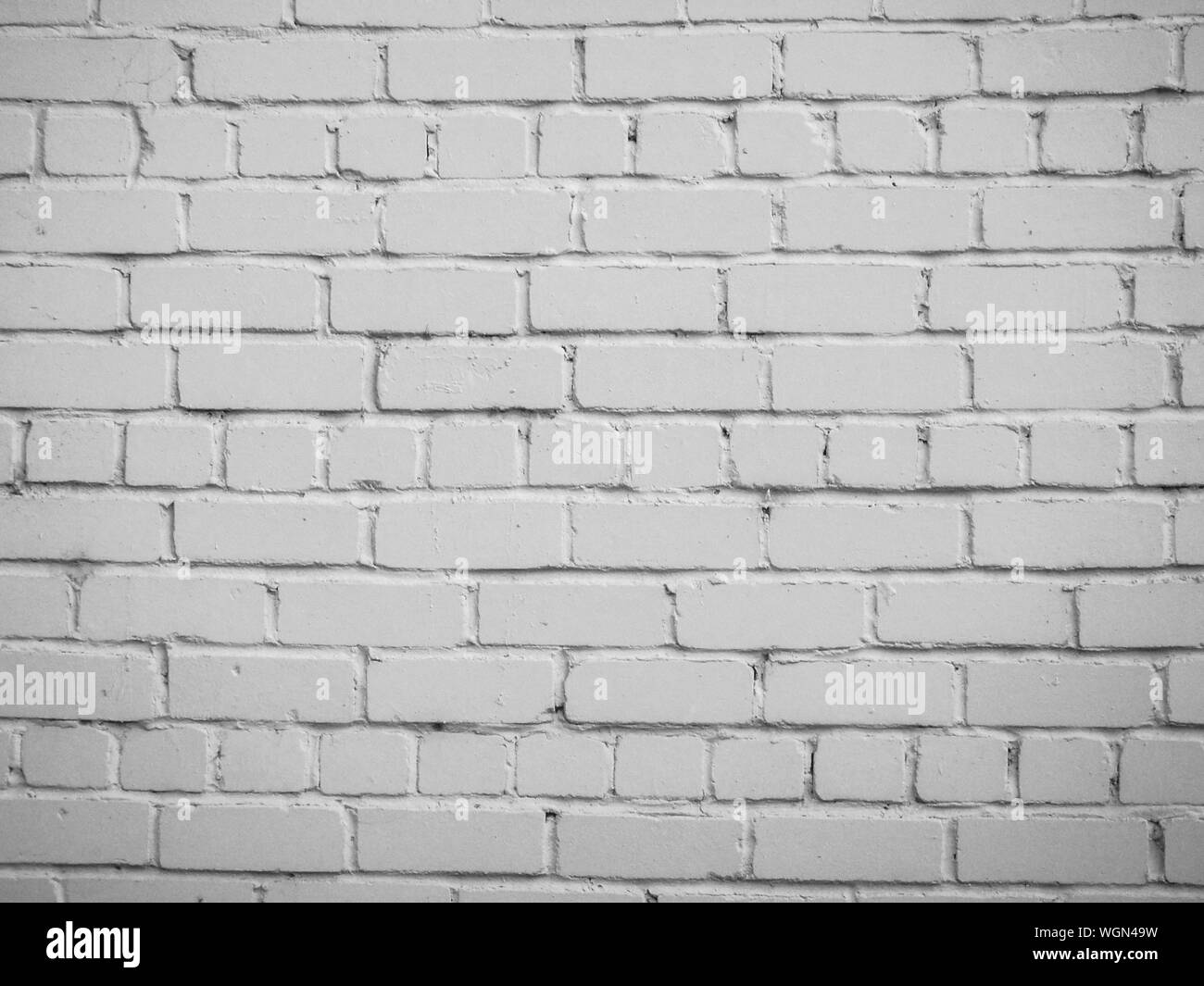 Texture of white brick wall - photo. Facade. Background. The element of architecture. The wall of the building. Stock Photo