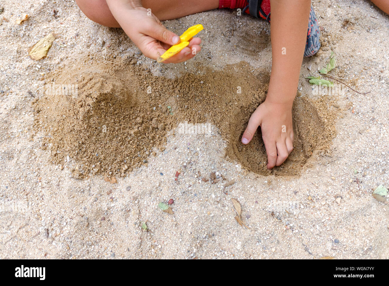 Playing dig digging hole hi-res stock photography and images - Alamy