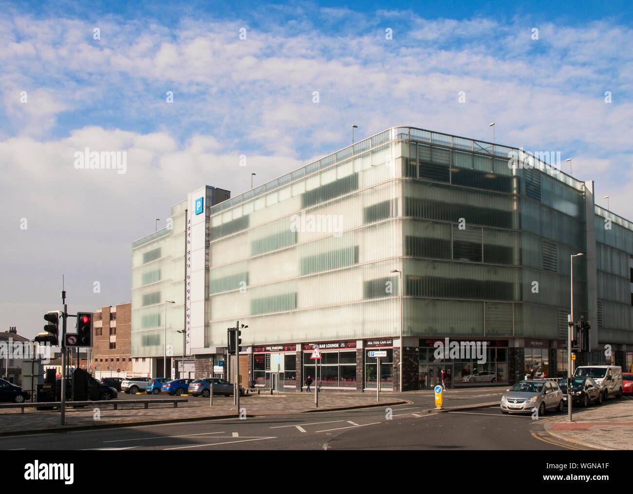 New modern facia cladding on 1930s multi storey car park  Used to be Bus station on ground floor  Now Mr Basrais Restaurant and the Gym fitness centre Stock Photo