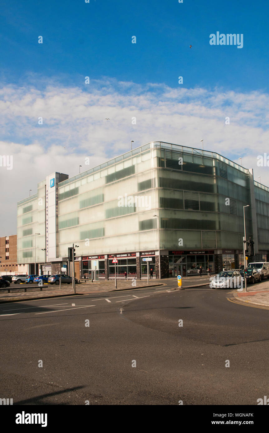 New modern facia cladding on 1930s multi storey car park  Used to be Bus station on ground floor  Now Mr Basrais Restaurant and the Gym fitness centre Stock Photo