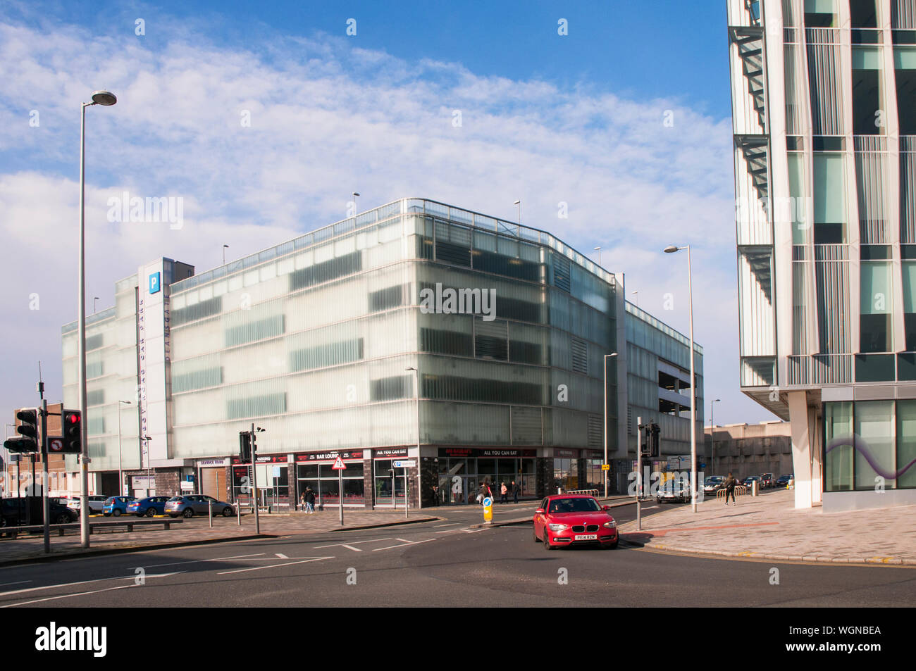 New modern facia cladding on 1930s multi storey car park  Used to be Bus station on ground floor  Now Mr Basrais Restaurant and the Gym fitness centre Stock Photo