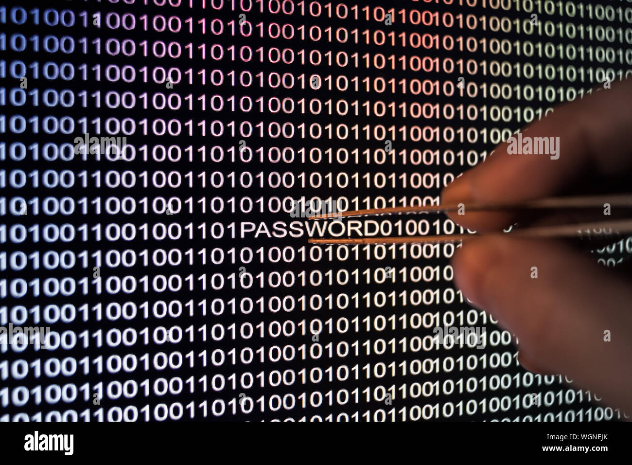Cropped Image Of Computer Hacker With Binary Codes Stock Photo