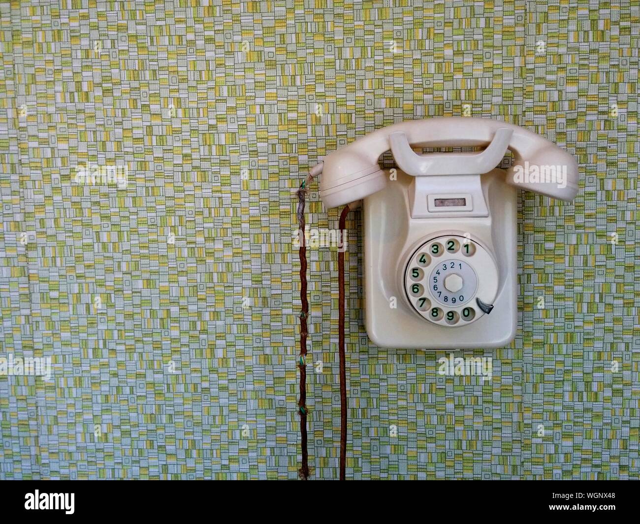 Old telephone mounted on wall hi-res stock photography and images - Alamy