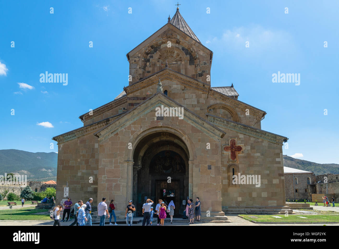 Mtskheta, Georgia - August 2019: Svetitskhoveli Cathedral of Mtskheta, Georgia and visitors. It is an Eastern Orthodox cathedral Stock Photo