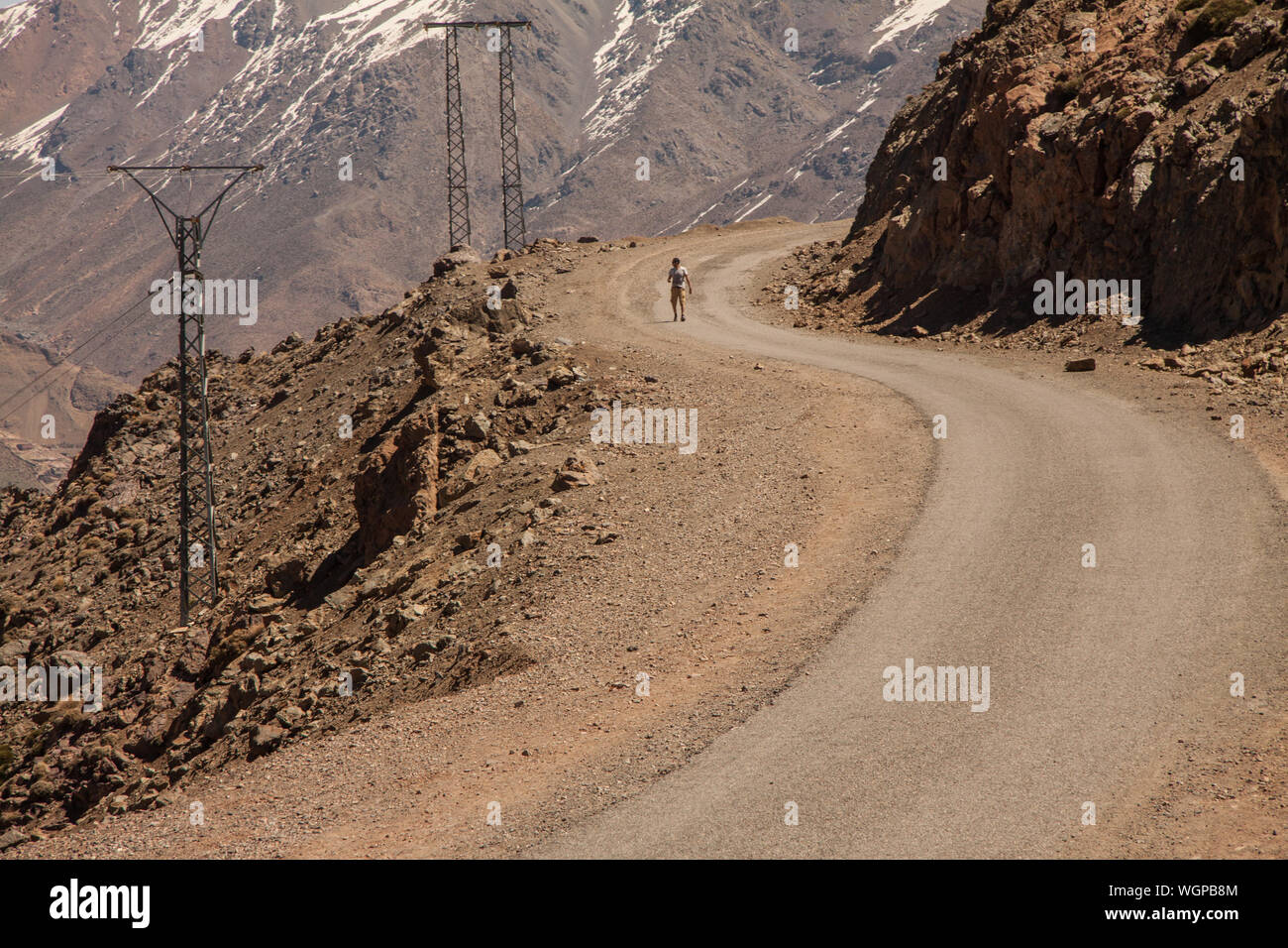 Man walking on winding road hi-res stock photography and images - Alamy
