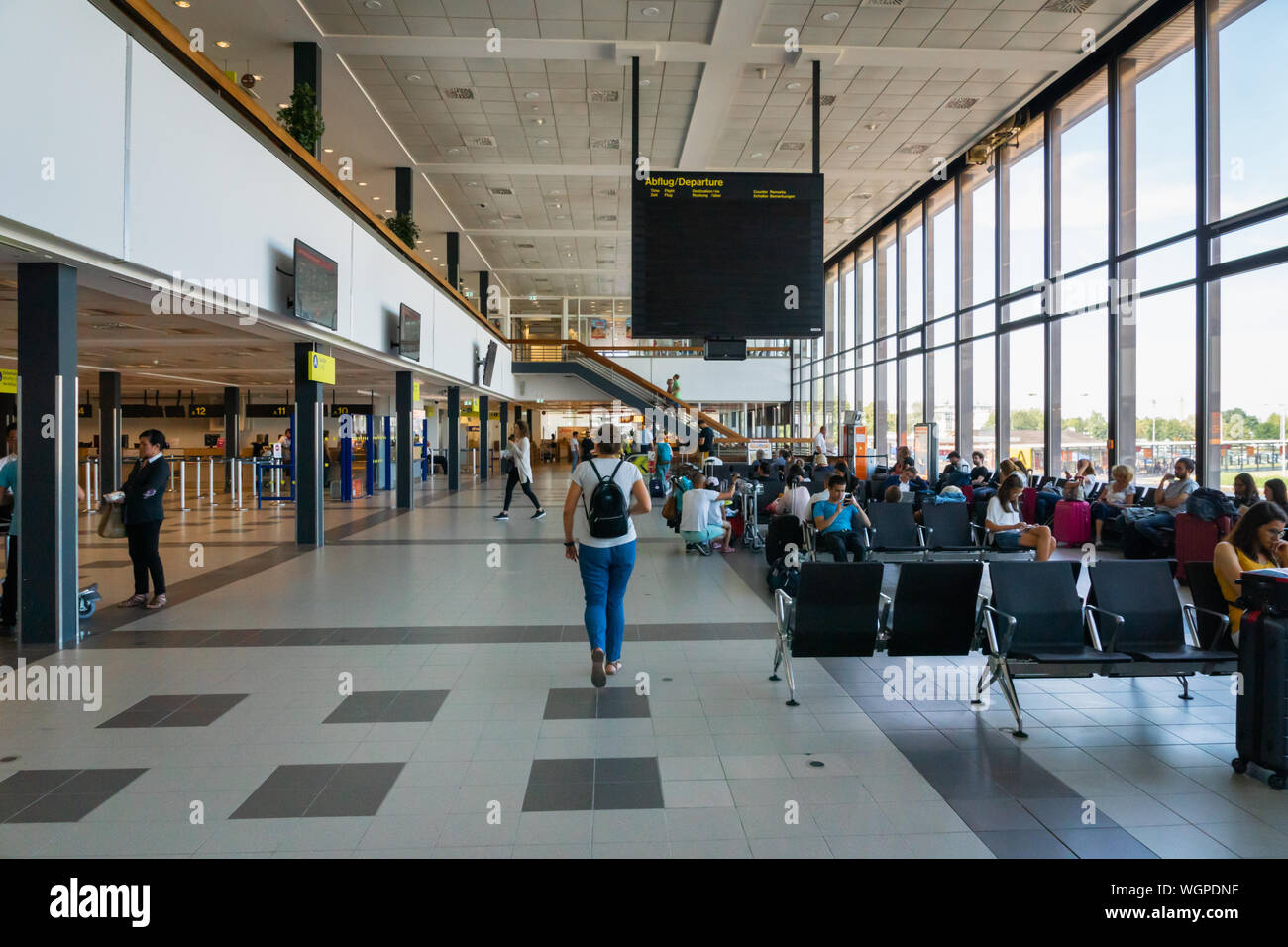 Berlin, Germany - July 2019: Berlin Schonefeld Airport architecture and passengers in Berlin, Germany. Stock Photo