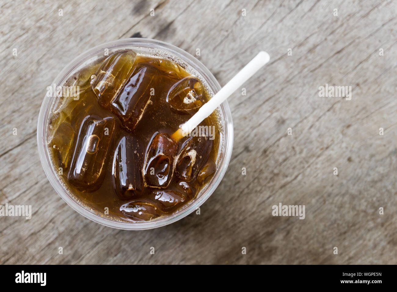 Directly Above Shot Of Iced Coffee On Wooden Table Stock Photo