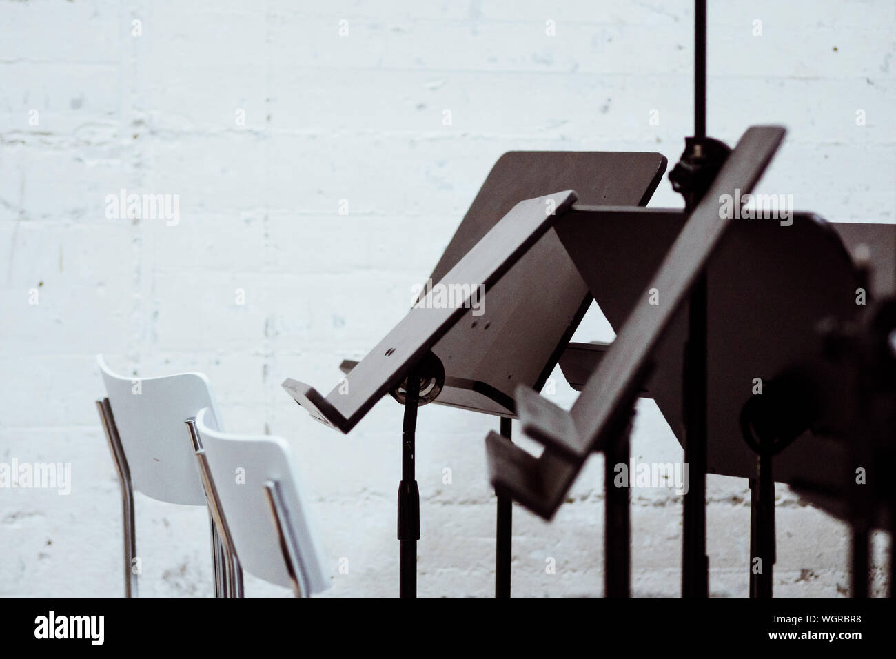 Chairs And Music Stands Against Wall Stock Photo Alamy