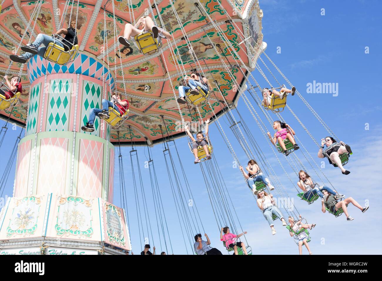 People Riding A Carnival Swing Ride At The Oregon State Fair