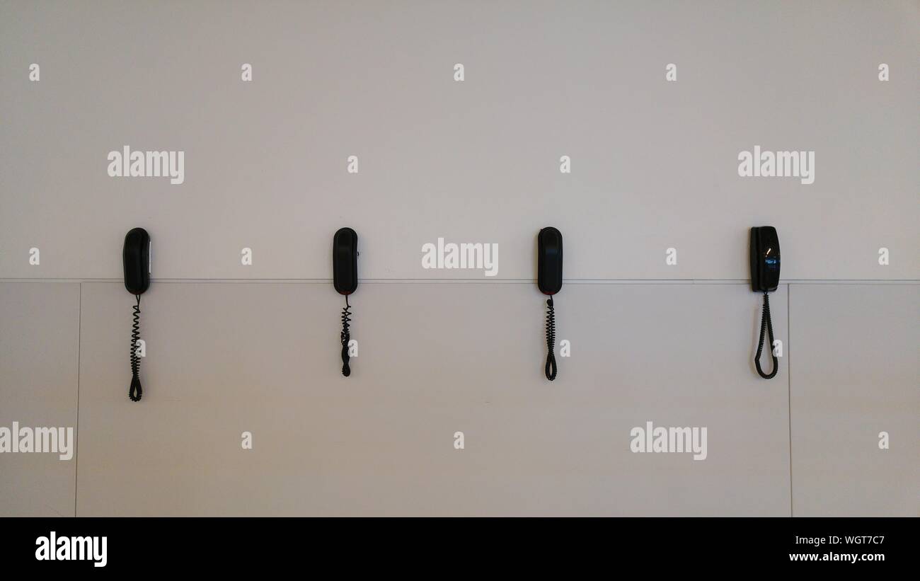Old telephone mounted on wall hi-res stock photography and images - Alamy
