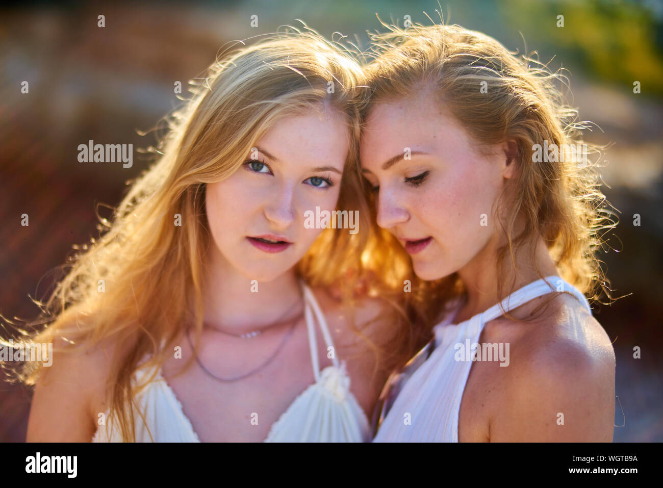 Two young beautiful women looking hi-res stock photography and images ...