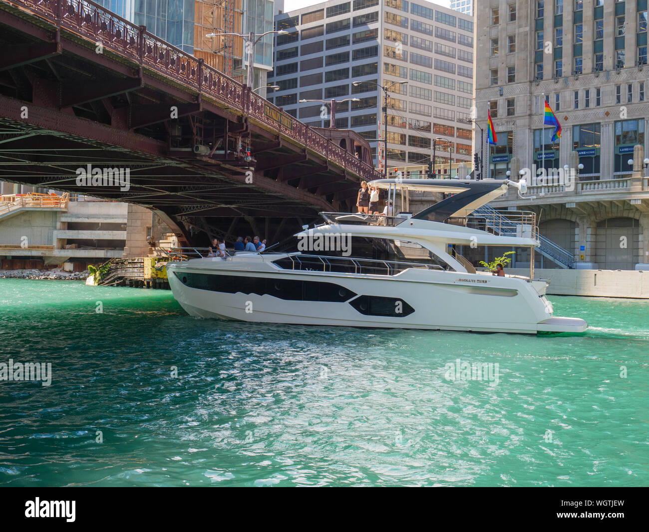 Cabin cruiser passing under Franklin Street Bridge, Chicago River. Stock Photo