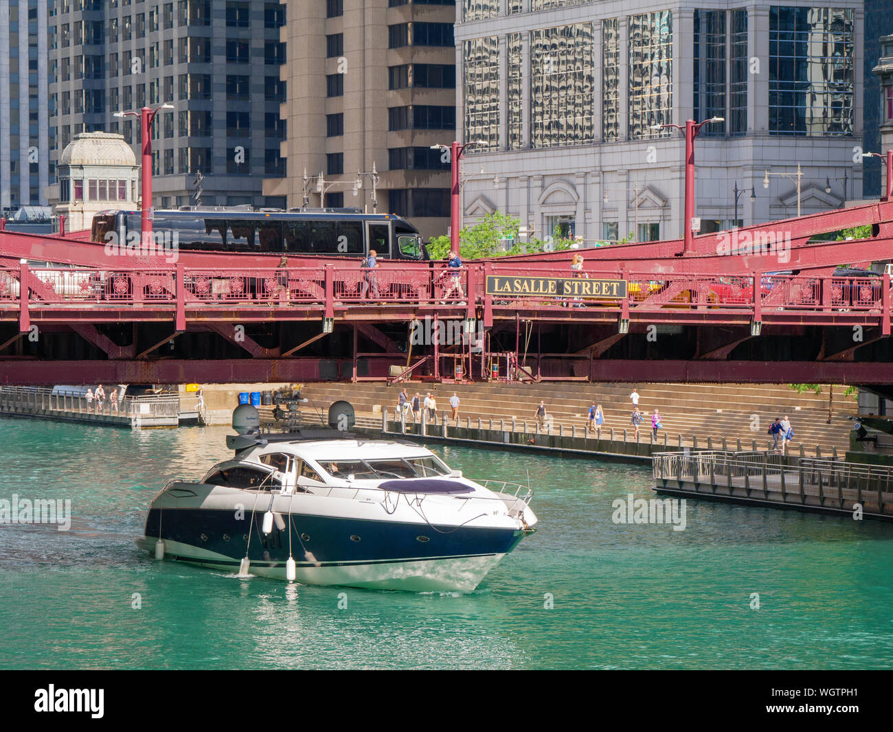 Cabin cruiser passing under LaSalle Street Bridge. Chicago River. Stock Photo