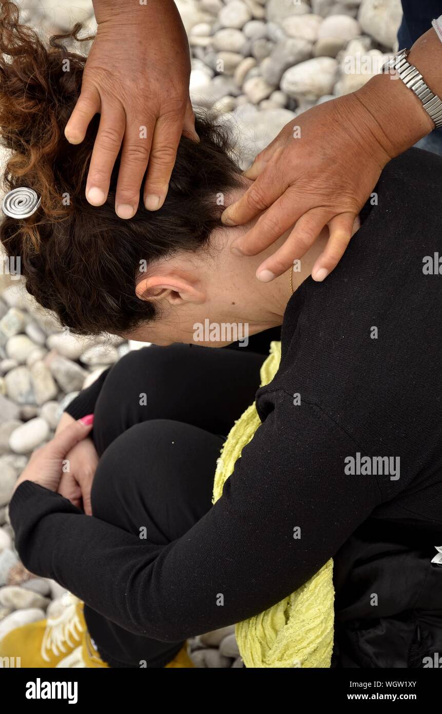 Cropped Hand Massaging Woman Neck Stock Photo