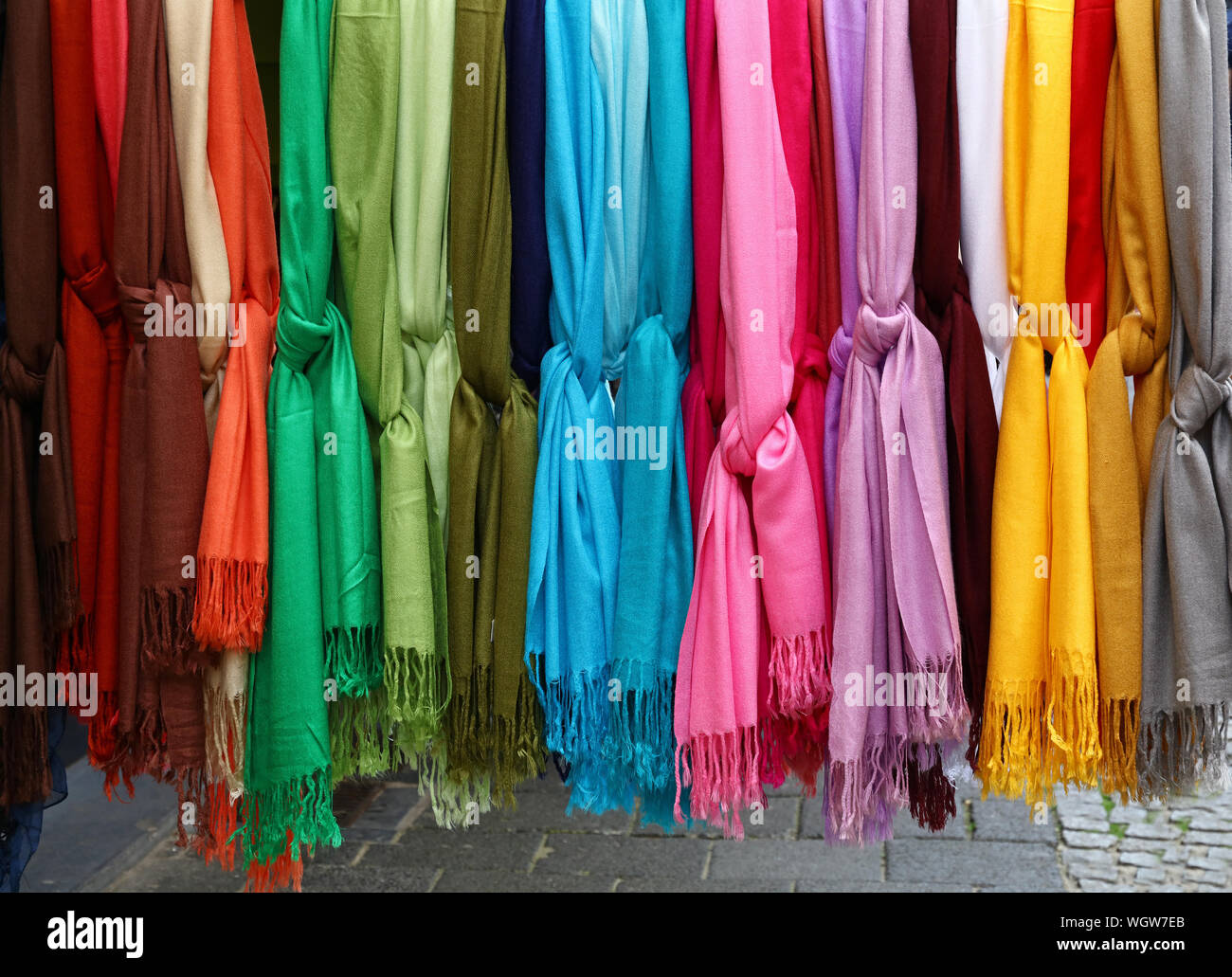 Close-up Of Colorful Shawls Hanging At Market Stock Photo