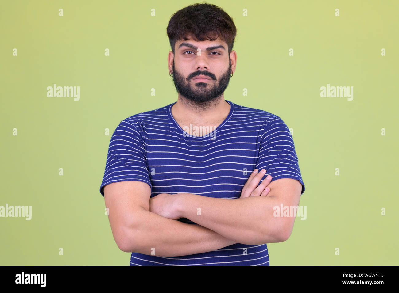 Young overweight bearded Indian man with arms crossed Stock Photo Alamy