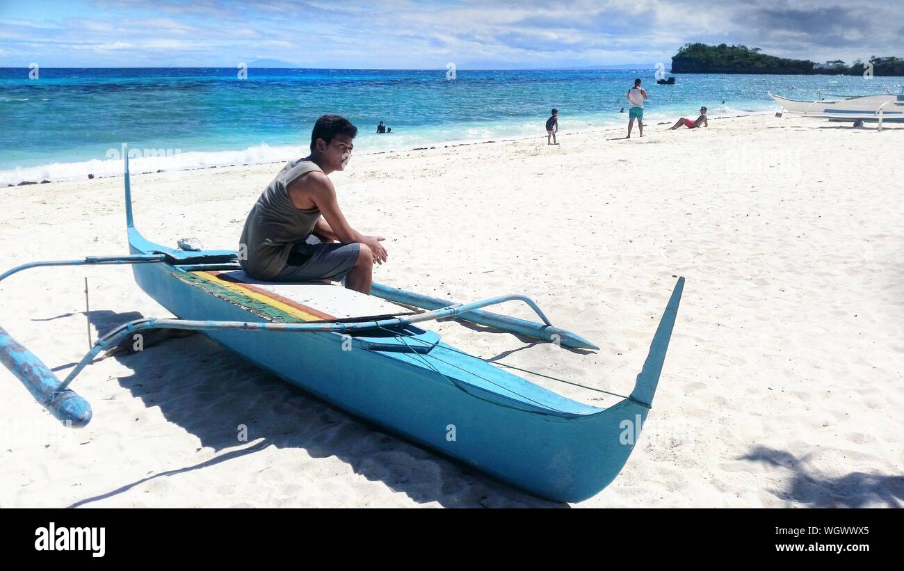 Indian man sitting on boat hi-res stock photography and images - Alamy