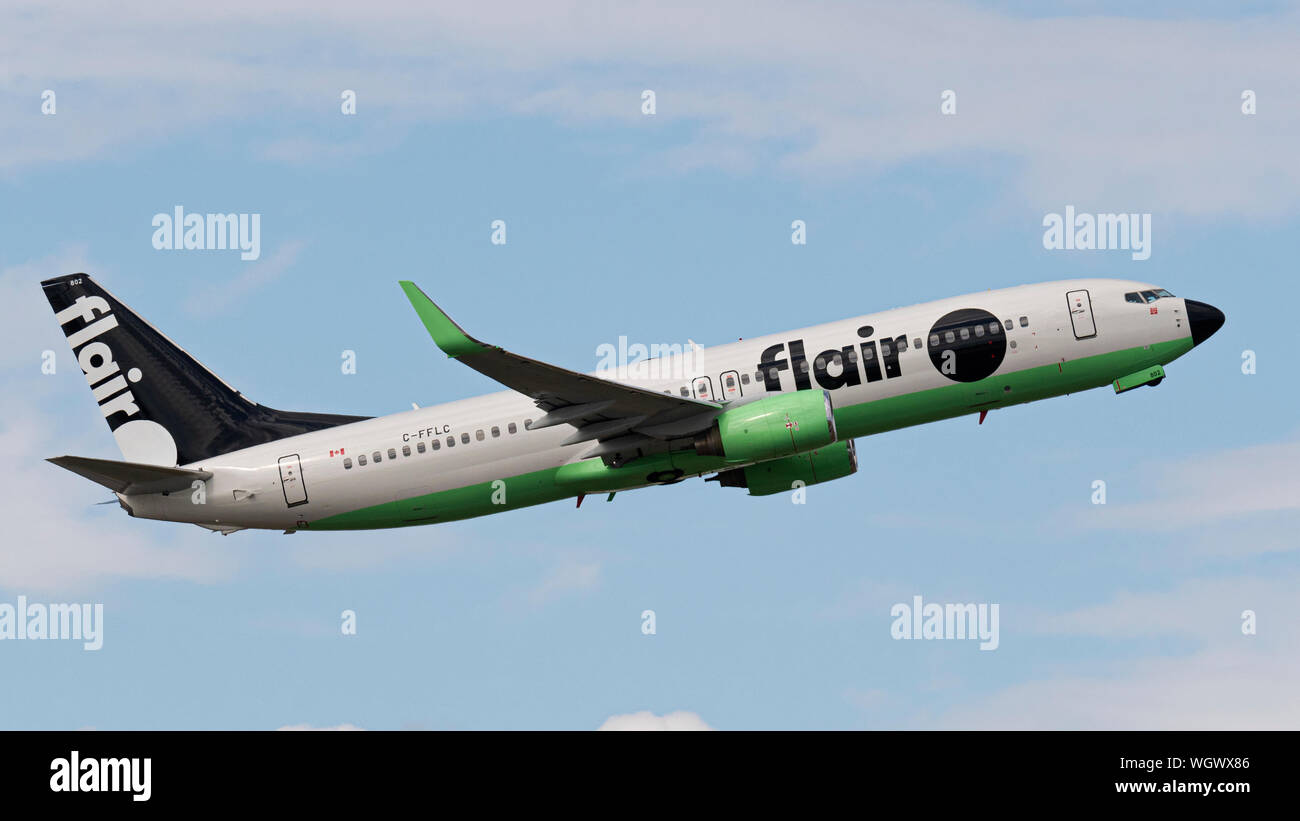 Flair Airlines plane Boeing 737-800 jet airliner low-cost Canadian airline air carrier airborne new-look livery logo Stock Photo