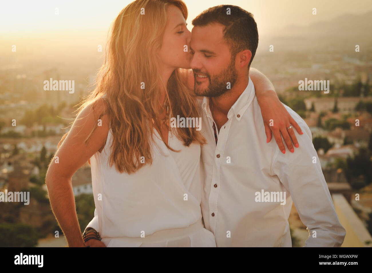 Young men kissing young woman hi-res stock photography and images - Alamy