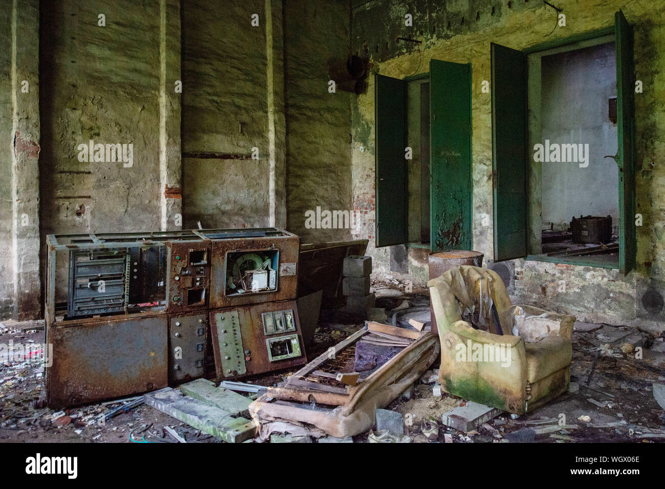 https://c8.alamy.com/comp/WGX06E/30-august-2019-saxony-anhalt-tangerhtte-an-old-control-panel-and-a-rotten-armchair-stand-in-a-building-of-the-former-tangerhtte-ironworks-when-the-plant-was-first-cast-in-1844-the-town-of-tangerhtte-was-still-called-vaethen-it-was-not-until-1928-that-vaethen-was-renamed-tangerhtte-after-the-hut-that-was-situated-on-the-tangier-river-today-the-site-of-the-ironworks-is-a-ruin-which-can-only-be-entered-with-a-permit-however-on-the-day-of-the-monument-8-september-2019-the-new-palace-built-by-the-family-of-factory-owners-not-far-from-the-ironworks-can-be-visited-photo-klaus-di-WGX06E.jpg