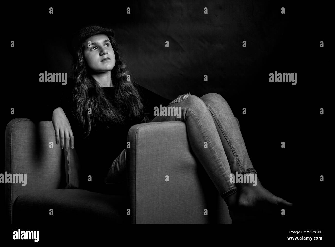 Woman on arm chair hi-res stock photography and images - Alamy