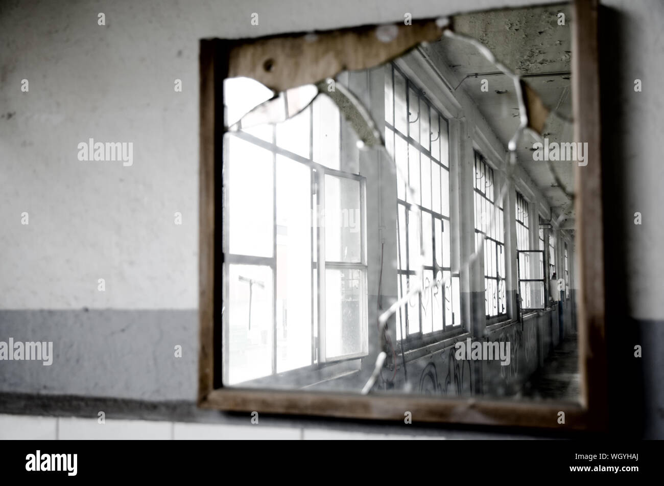 Closeup Of Cracked Mirror On Wall Stock Photo Alamy