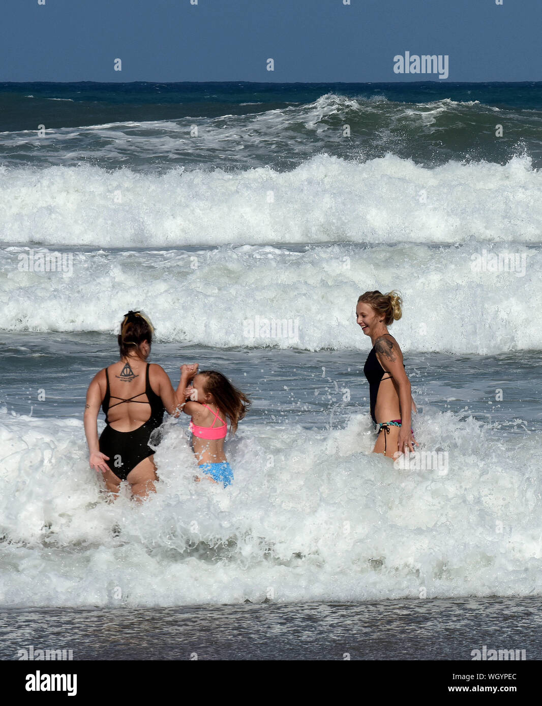 Indialantic Beach, United States. 01st Sep, 2019. People enjoy the heavy surf generated by Hurricane Dorian. The Category 5 storm is expected to come dangerously close to the Florida coast as early as tomorrow night. Credit: SOPA Images Limited/Alamy Live News Stock Photo