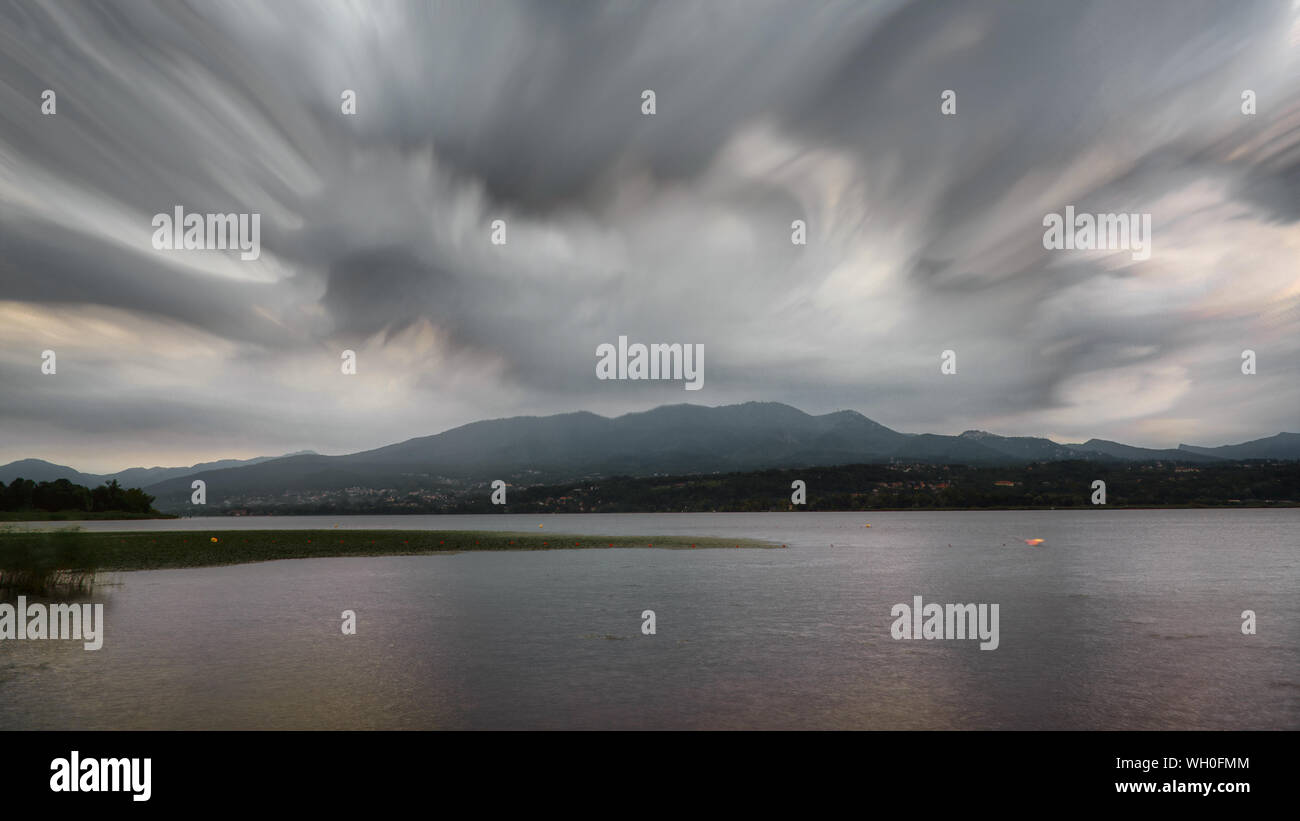 Dramatic cloudy sky over the lake of Varese in rainy summer day Stock Photo