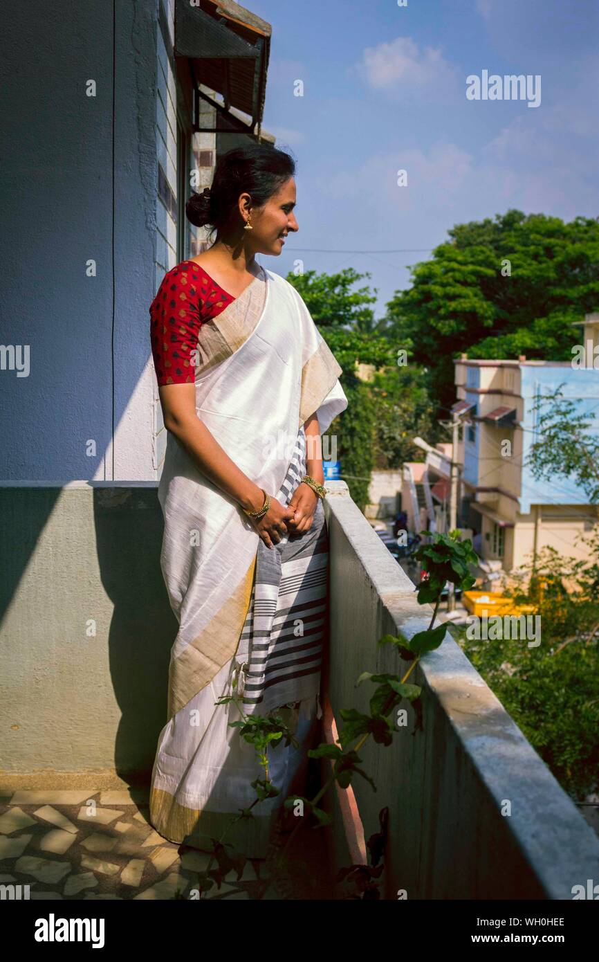 Indian woman standing in balcony hi-res stock photography and images ...