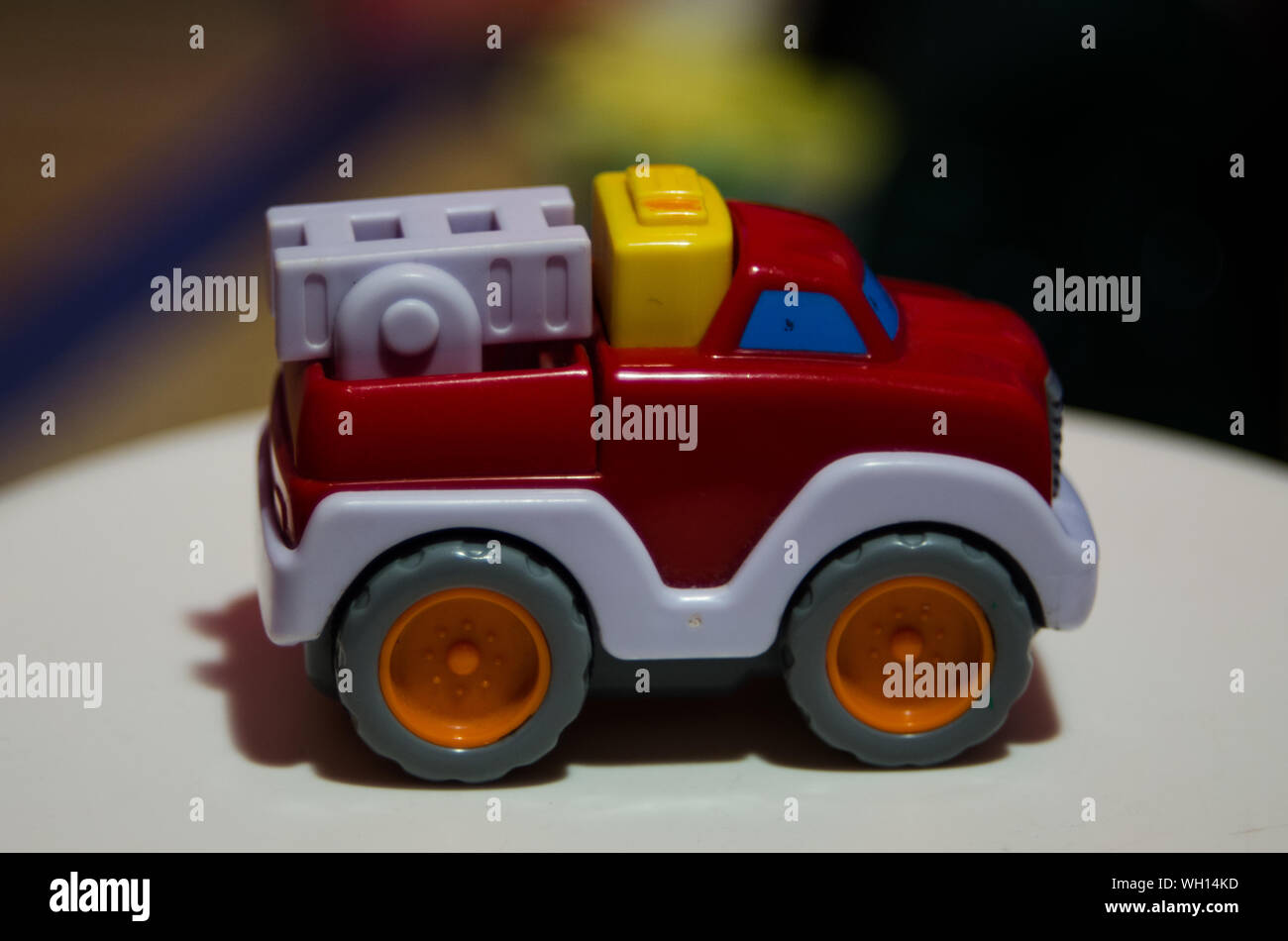 Close-up Of Toy Fire Engine On Table Stock Photo