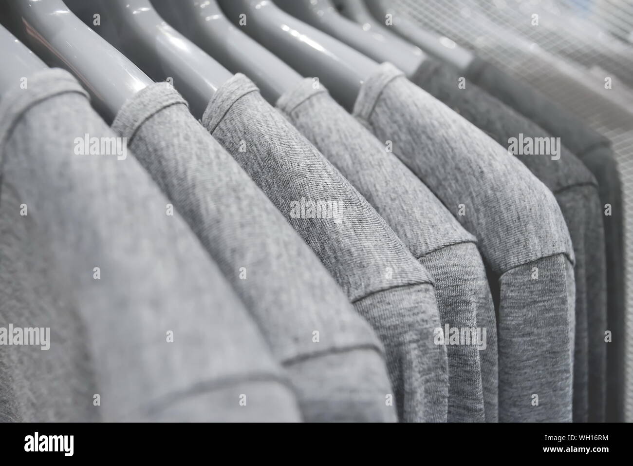 Hanging polo shirts on rack in the shopping mall Stock Photo Alamy