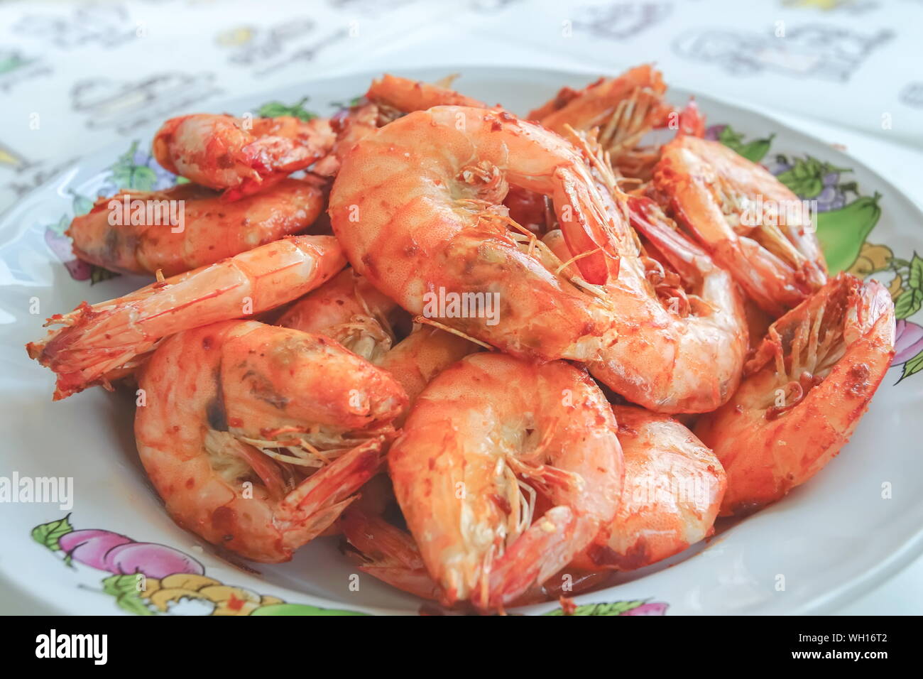 Closed up Oil free fried shrimps in plate made by air frier. Stock Photo