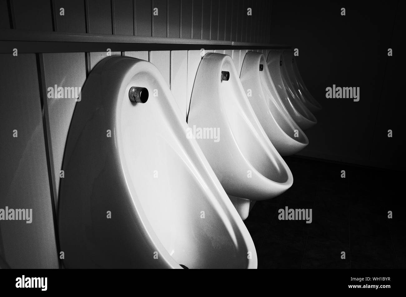 White urinal in public restroom Black and White Stock Photos & Images