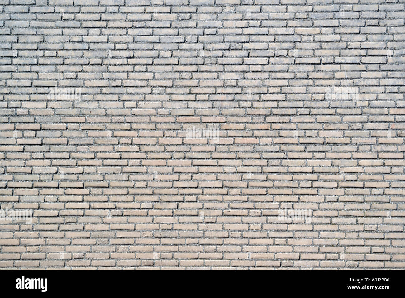 yellow colored brick wall for background use Stock Photo