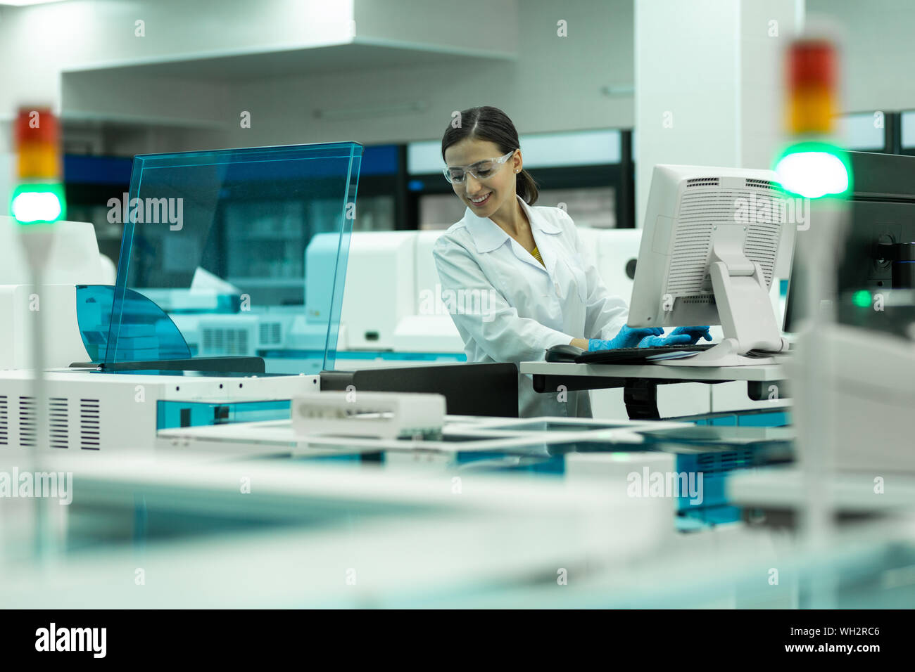 Cheerful medical worker testing new computer program Stock Photo