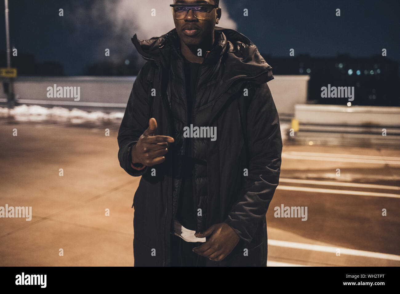 Young African Man Outdoors Posing Looking Camera Swag Street