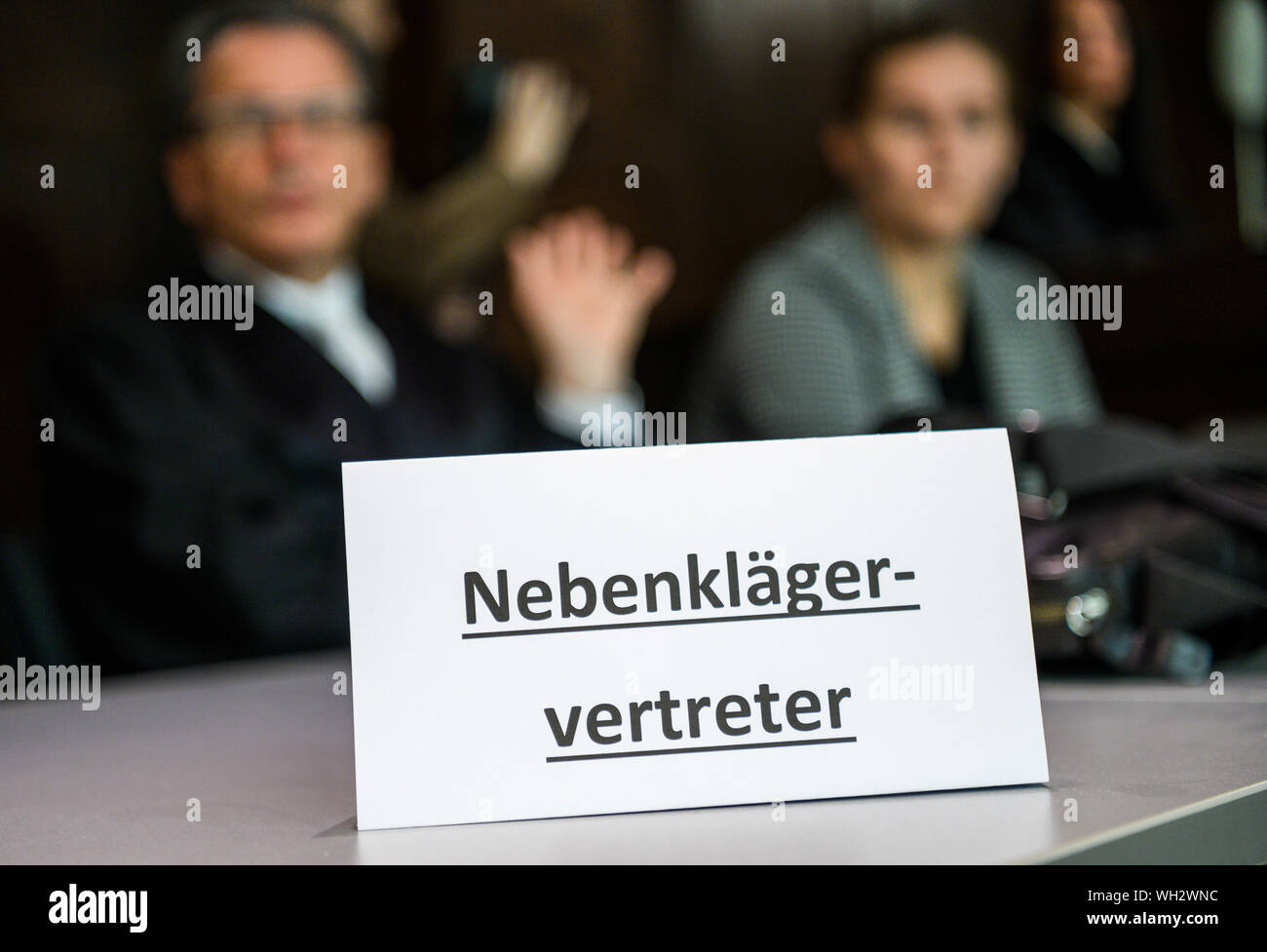 02 September 2019, Lower Saxony, Emden: A joint plaintiff (r) sits next to her lawyer in the courtroom shortly before the trial begins. The tragic case had caused consternation in August 2016, when two boats, each with four young occupants, had driven together on the way back from the harbour festival in Barßel. A skipper is said to have been drunk with 1.89 per mille and to have driven too fast. After years of wrangling over jurisdiction, the Federal Supreme Court referred the case to Emden. Seven witnesses have been summoned for the sole day of the trial. Photo: Mohssen Assanimoghaddam/dpa Stock Photo