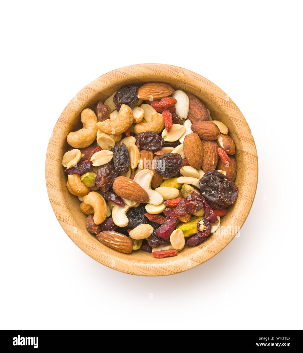 Mix of various nuts and raisins in bowl isolated on white background. Stock Photo