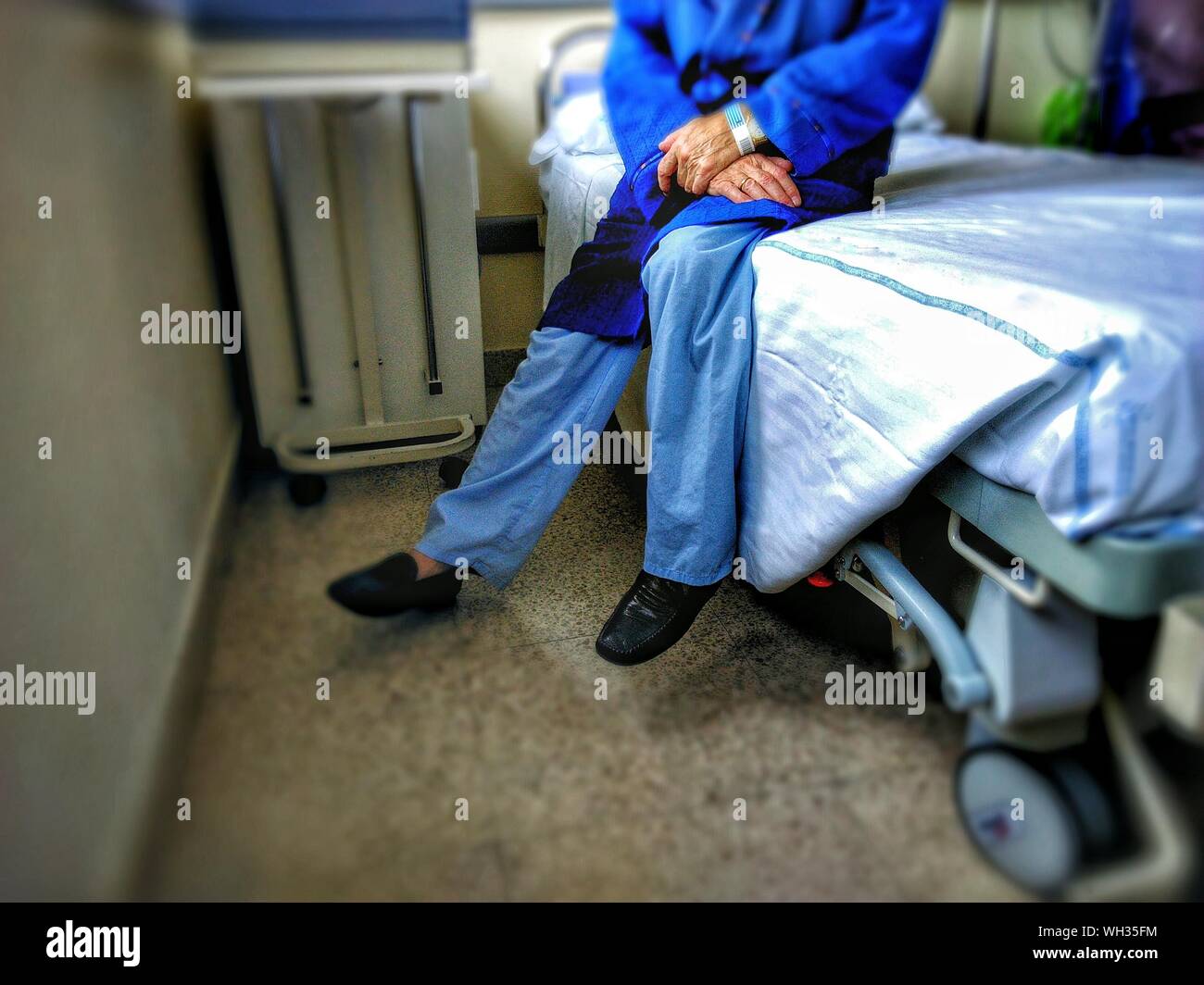 Hospital bed man sitting hi-res stock photography and images - Alamy