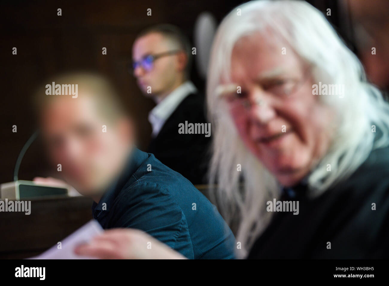 02 September 2019, Lower Saxony, Emden: The defendant (l) is sitting next to his defender Reinhard Nollmann in the courtroom shortly before the start of the trial. The tragic case had caused consternation in August 2016, when two boats, each with four young occupants, had driven together on the way back from the harbour festival in Barßel. A skipper is said to have been drunk with 1.89 per mille and to have driven too fast. After years of wrangling over jurisdiction, the Federal Supreme Court referred the case to Emden. Seven witnesses have been summoned for the sole day of the trial. Parts of Stock Photo