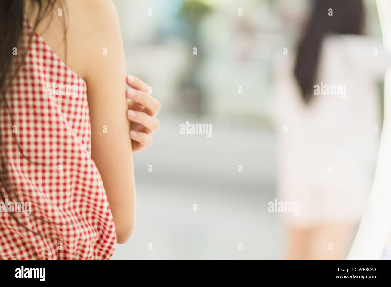 Woman Touching Arm Her High Resolution Stock Photography and Images - Alamy