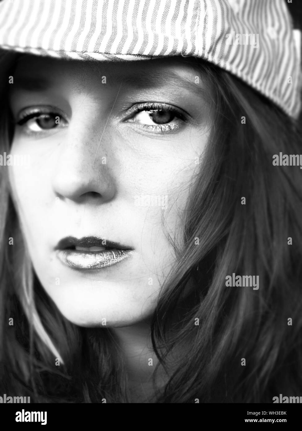 Young woman wearing flat cap Black and White Stock Photos & Images Alamy