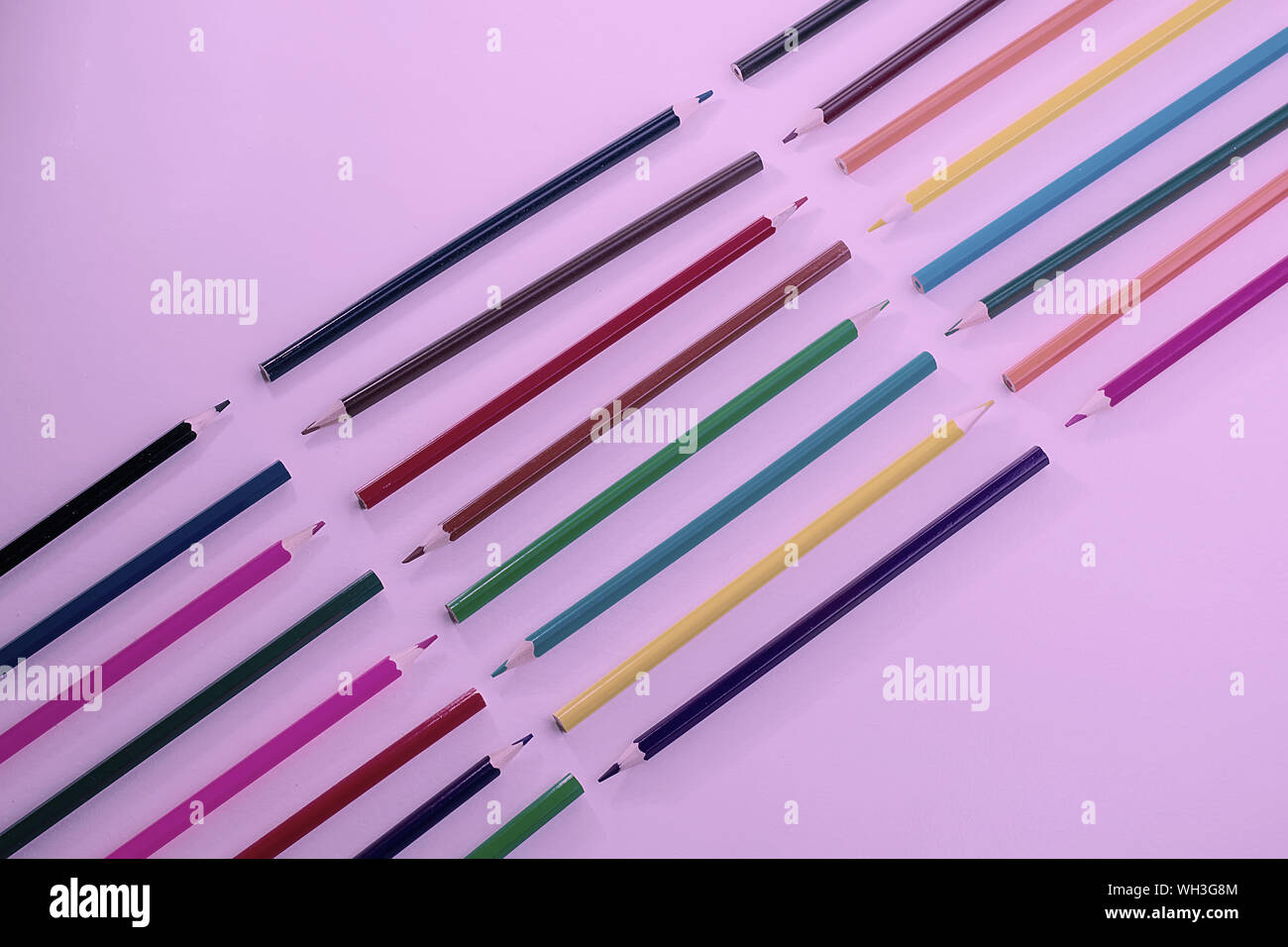 Light Pencil Patterns A pattern of wooden color pencils in neon light. Minimal beauty concept ...