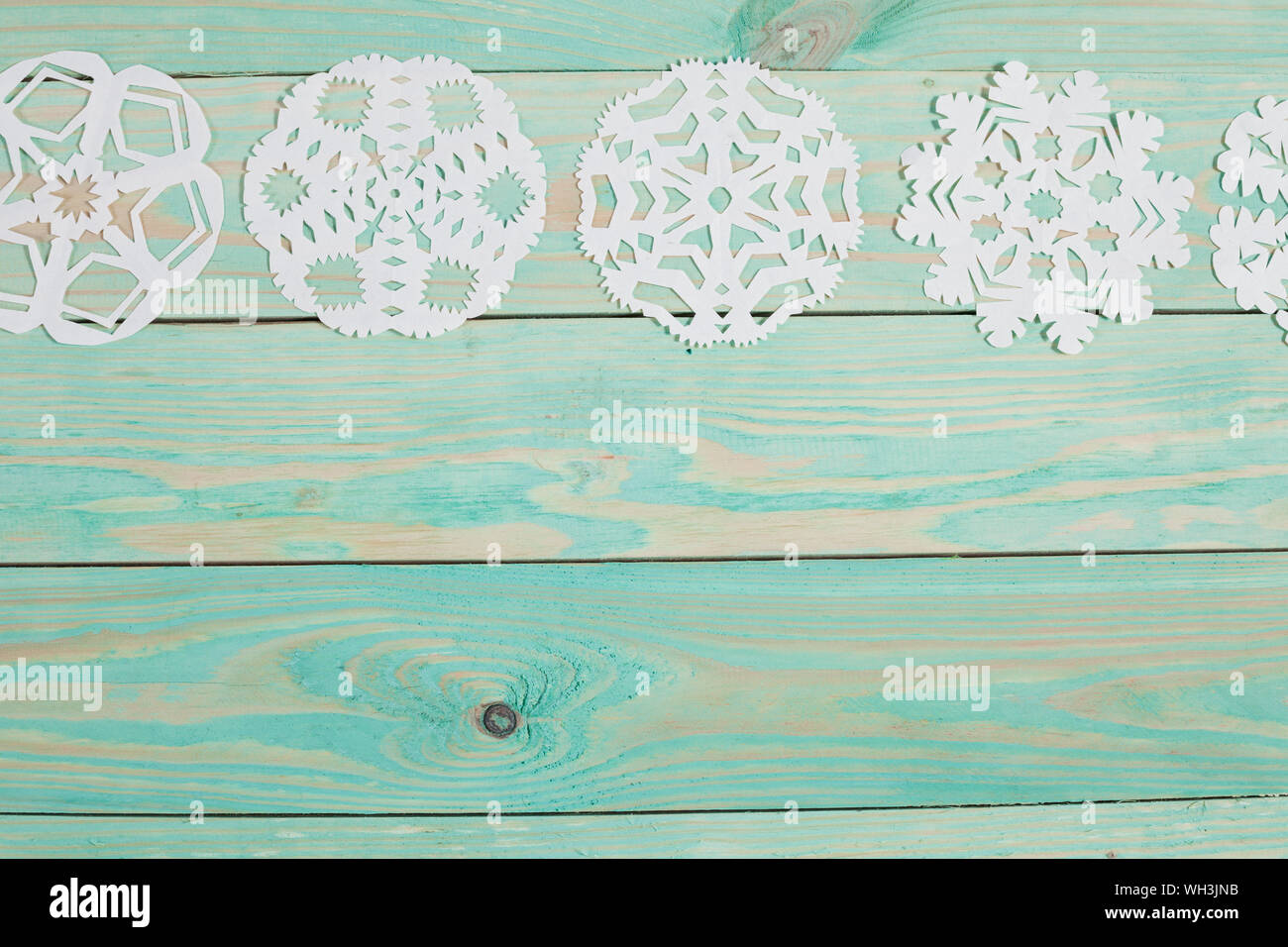 Paper snowflake and tied with twine. Stock Photo