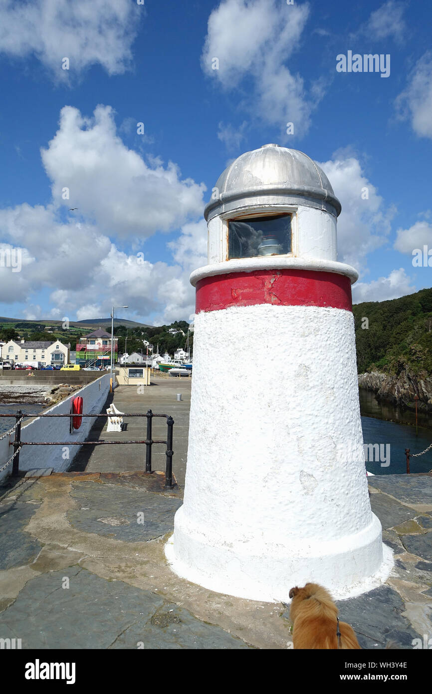 Port-hand (red) navigation beacon at the entrance to Laxey Harbour, Isle of Man Stock Photo