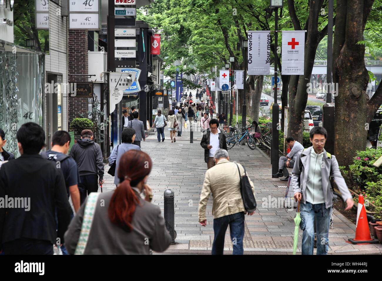 TOKYO, JAPAN - MAY 9, 2012: People shop in Omotesando district in Tokyo. Omote-sando is considered one of most important shopping areas in Tokyo, the Stock Photo