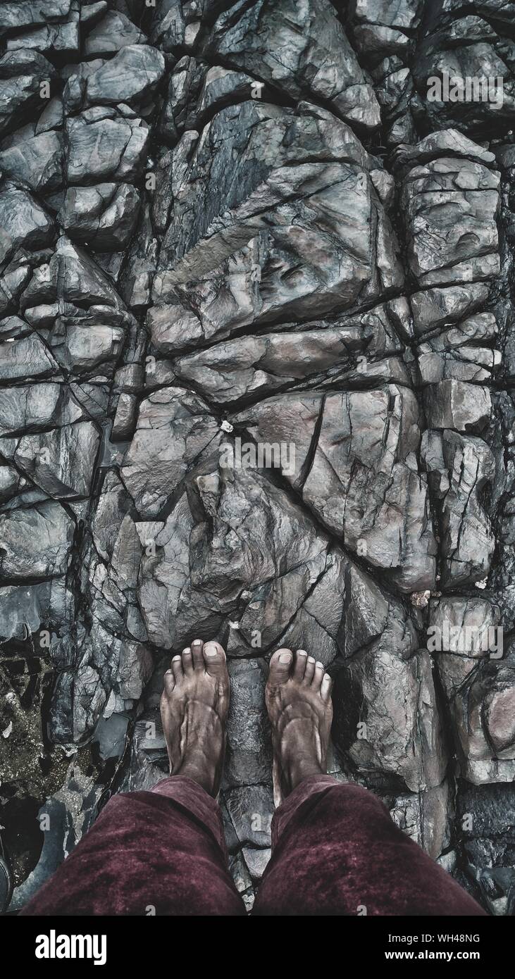 Man standing barefoot on rock hi-res stock photography and images - Alamy