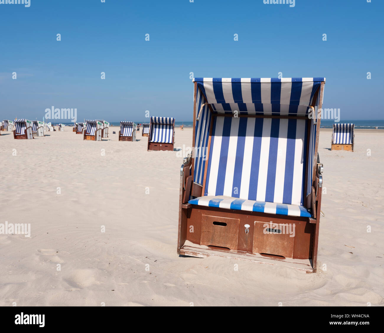 beach korbs on the island of norderney in germany on sunny day Stock Photo