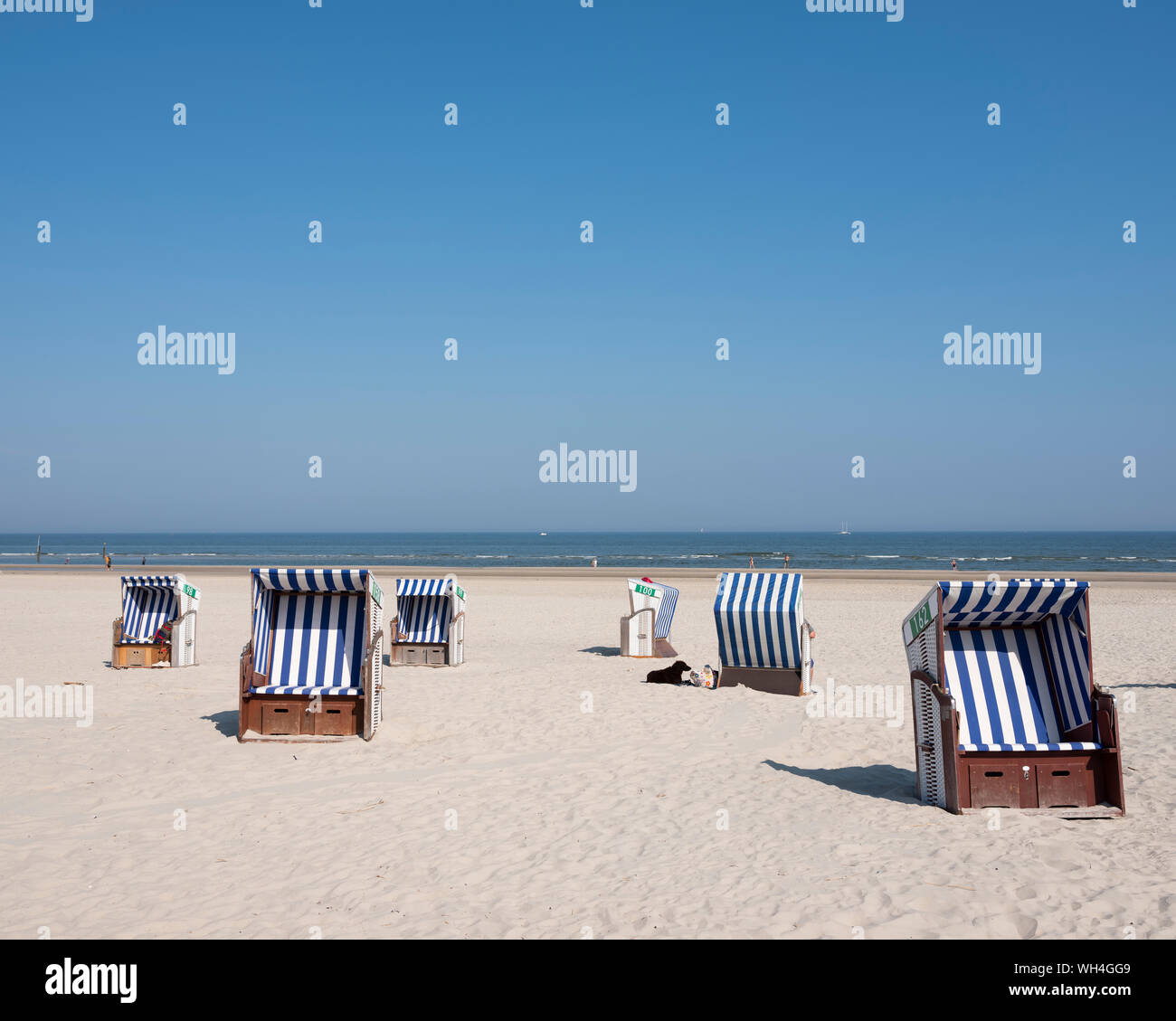 beach korbs on the island of norderney in germany on sunny day Stock Photo